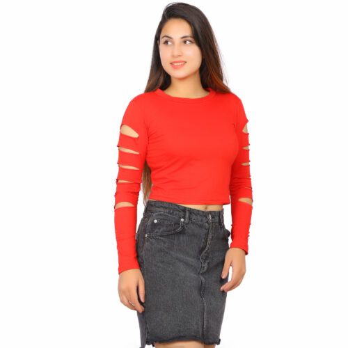 Woman wearing red cut-out sleeve crop top with black denim skirt – front view